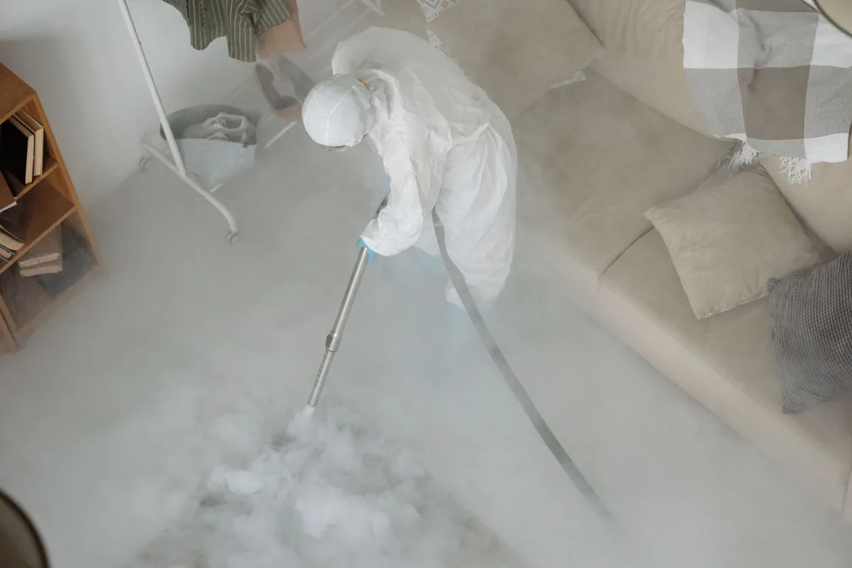 Biohazard cleanup technician in protective equipment, Dexter, ME